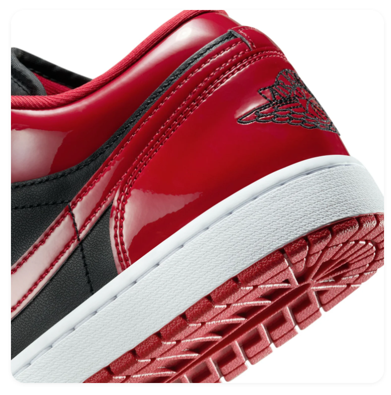 Air Jordan 1 Low Black and Glossy Red Sneakers