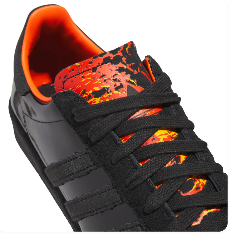 Adidas Black Glossy Sneakers with Orange Lining and Flame-Pattern Tongue
